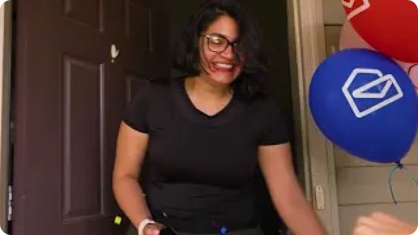 A winner opens her door to the Prize Patrol